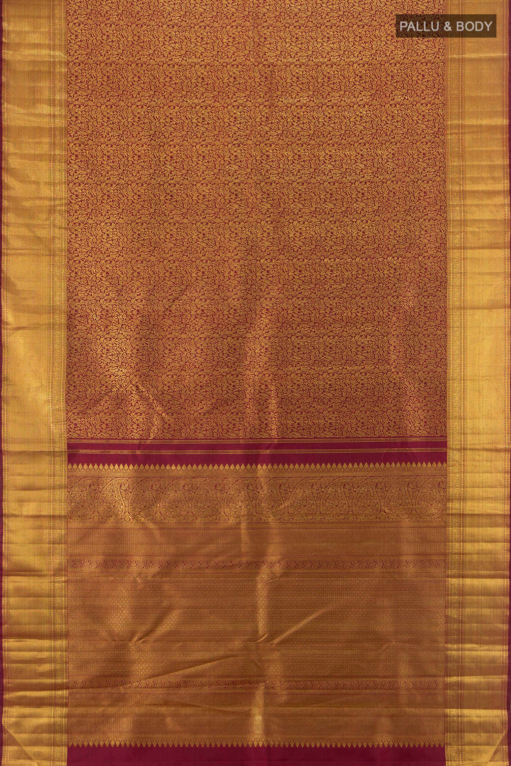 Flat view of Maroon Kanchipuram Silk Saree with Zari Brocade on the body and Zari Border. 