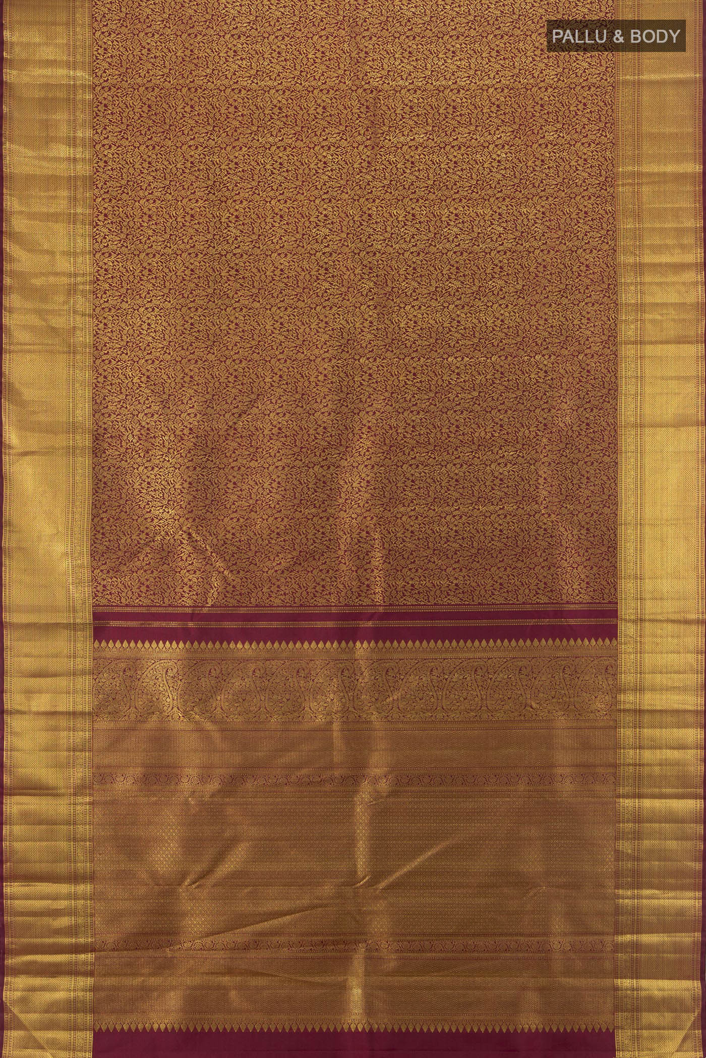 Flat view of Maroon Kanchipuram Silk Saree with Zari Brocade on the body and Zari Border. 