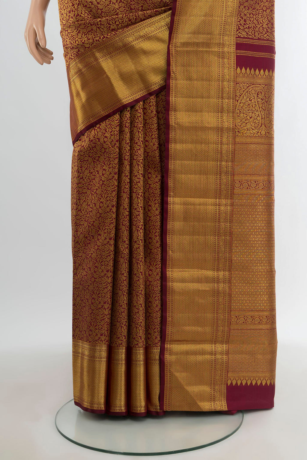 Pleats and pallu of Maroon Kanchipuram Silk Saree with Zari Brocade on the body and Zari Border. 