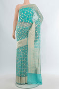 Sky Blue Banarasi Kora Silk Saree with Zari Butta on the body and Zari Border.  displayed on a mannequin