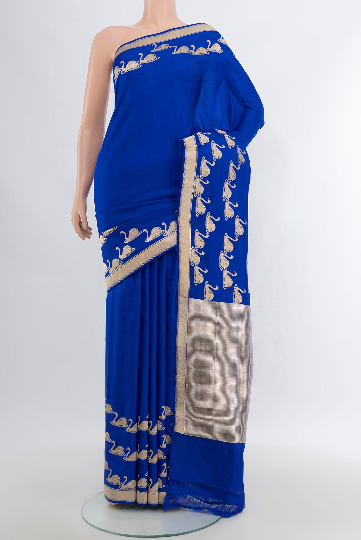 Royal Blue Banarasi Silk Saree with Plain Body and Zari Border.  displayed on a mannequin
