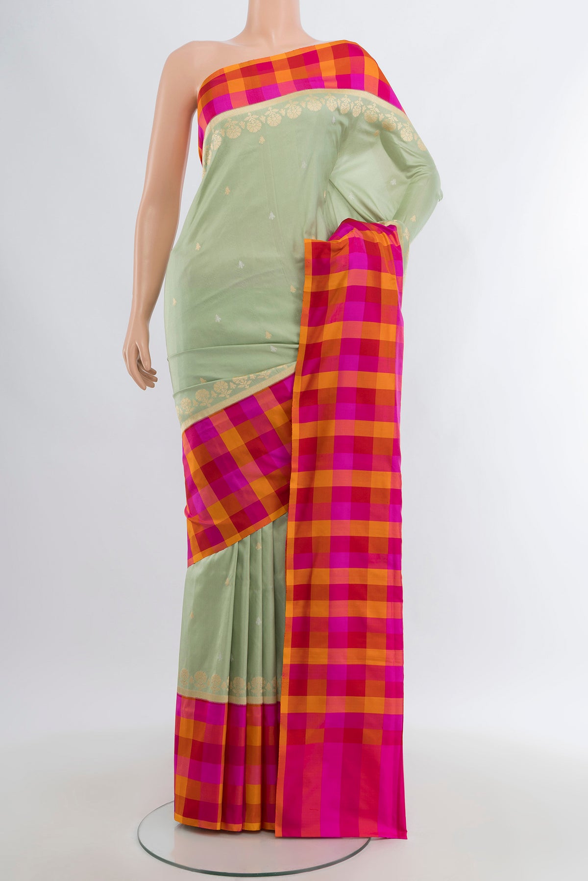 Pista Green Banarasi Silk Saree with Zari Butta on the body and Fancy Border.  displayed on a mannequin
