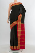Black Mysore Crepe Saree with Plain Body and Zari Border.  displayed on a mannequin