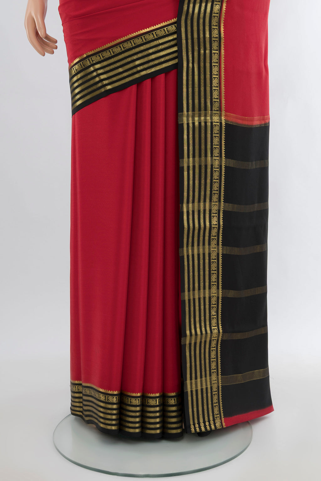 Pleats and pallu of Red Mysore Crepe Saree with Plain Body and Zari Border. 