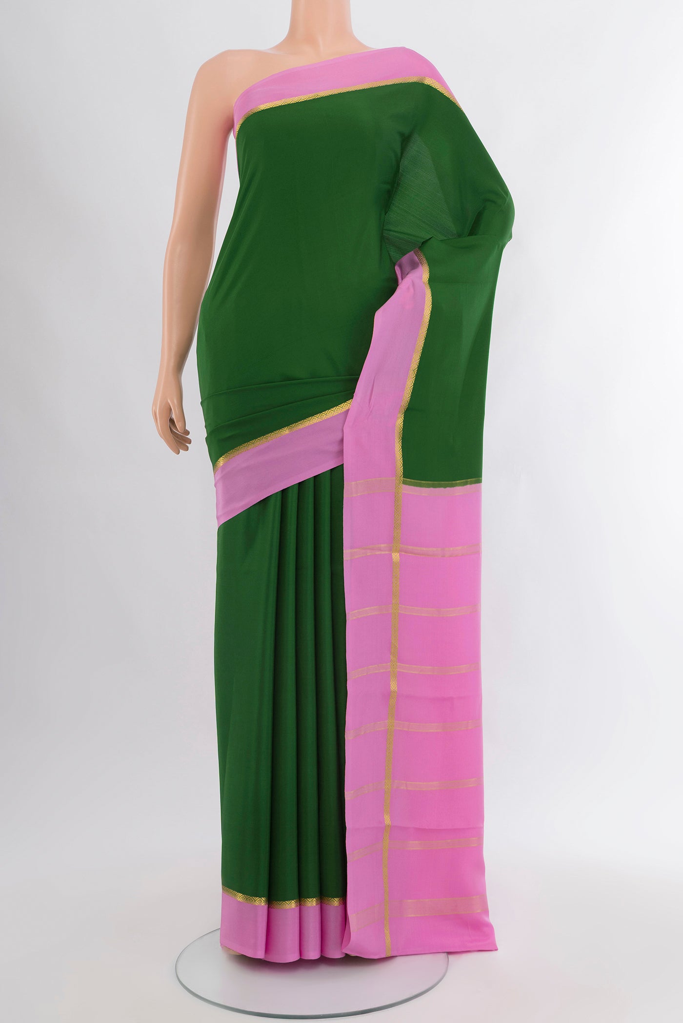 Green Mysore Crepe Saree with Plain Body and Plain Border.  displayed on a mannequin