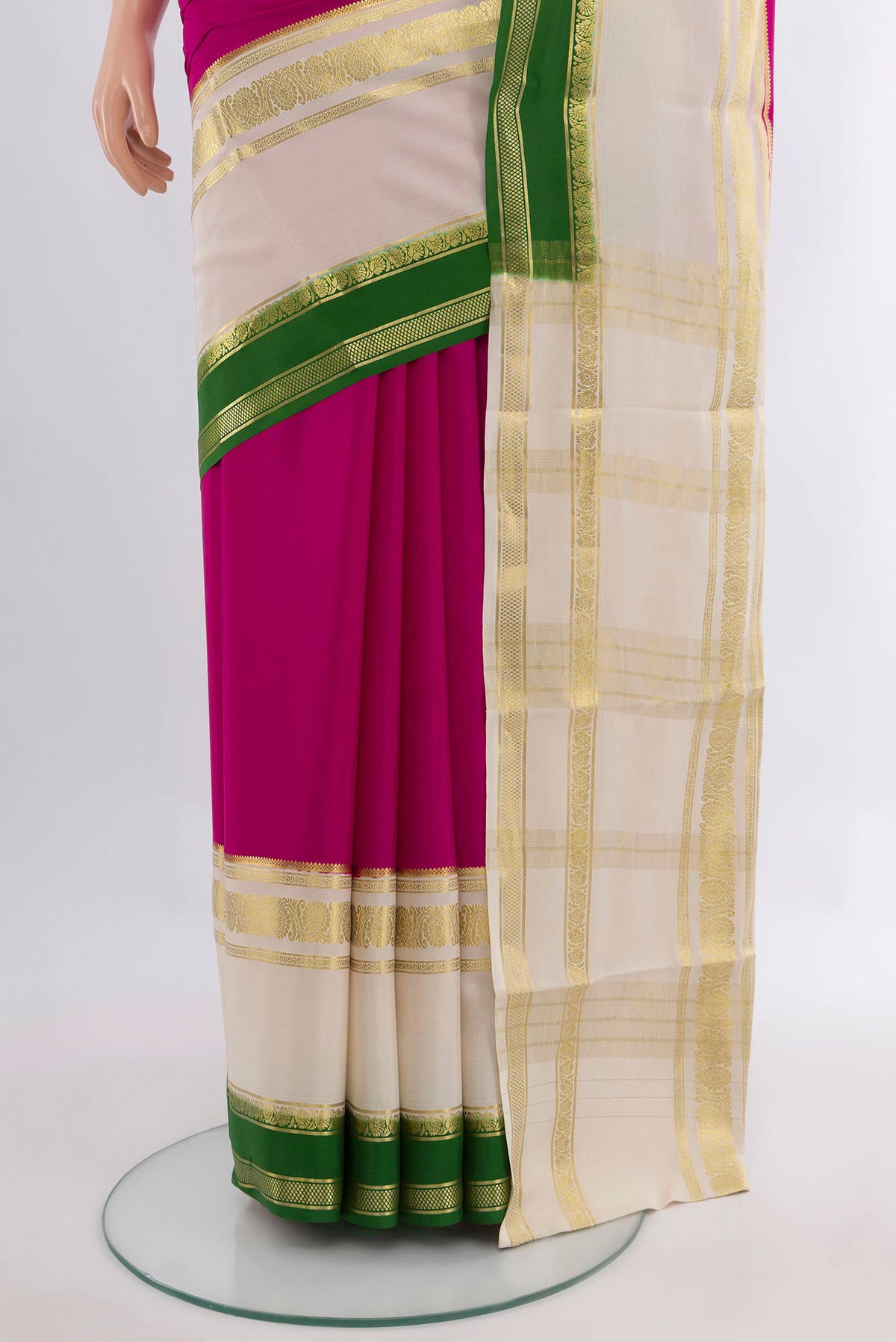 Pleats and pallu of Magenta Mysore Crepe Saree with Plain Body and Zari Border. 
