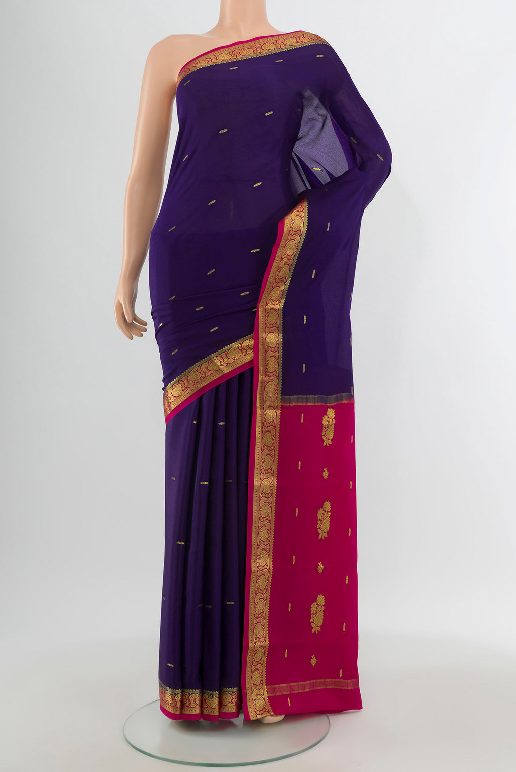 Navy Blue Mysore Crepe Saree with Zari Butta on the body and Zari Border.  displayed on a mannequin