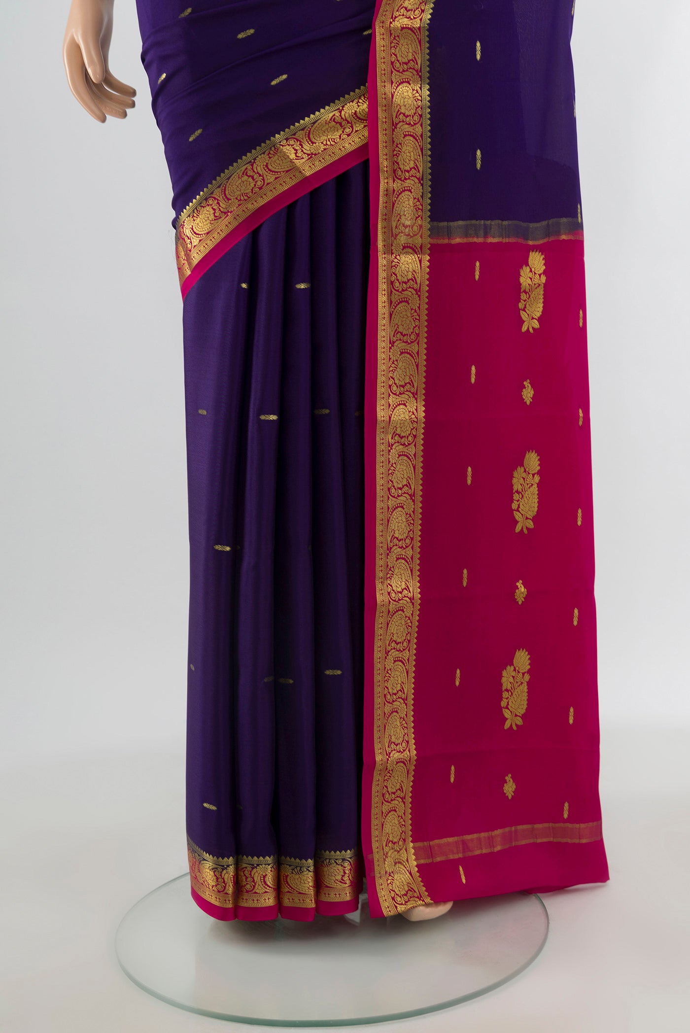 Pleats and pallu of Navy Blue Mysore Crepe Saree with Zari Butta on the body and Zari Border. 