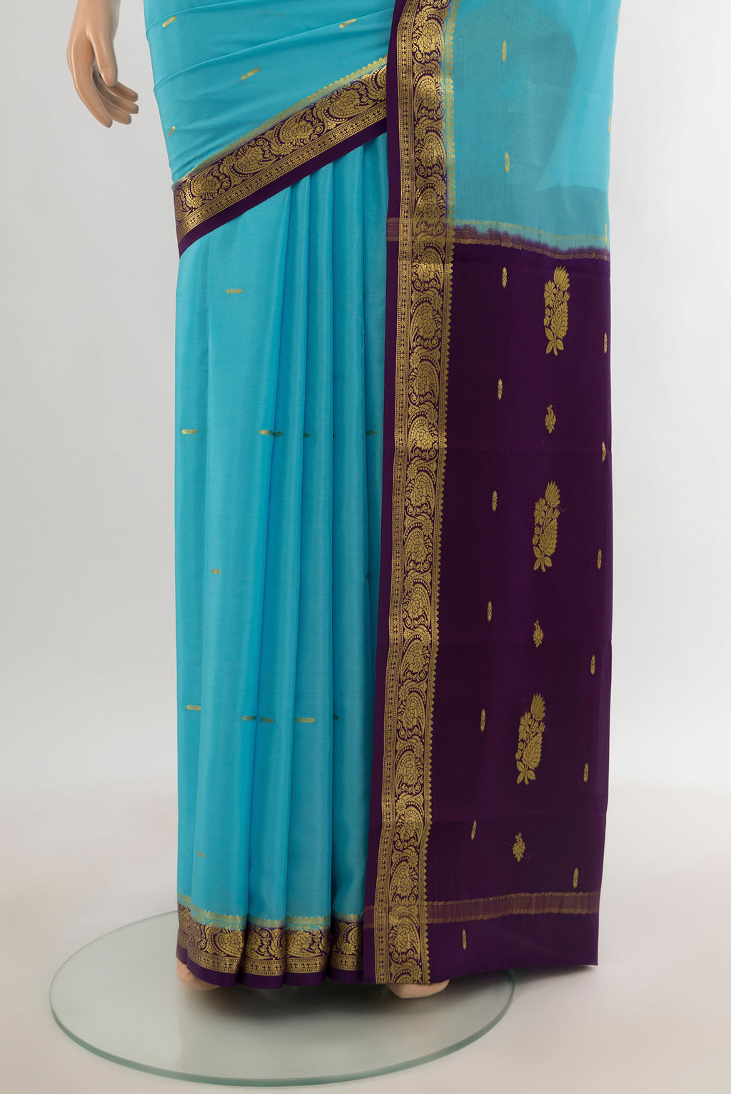 Pleats and pallu of Sky Blue Mysore Crepe Saree with Zari Butta on the body and Silk Border. 