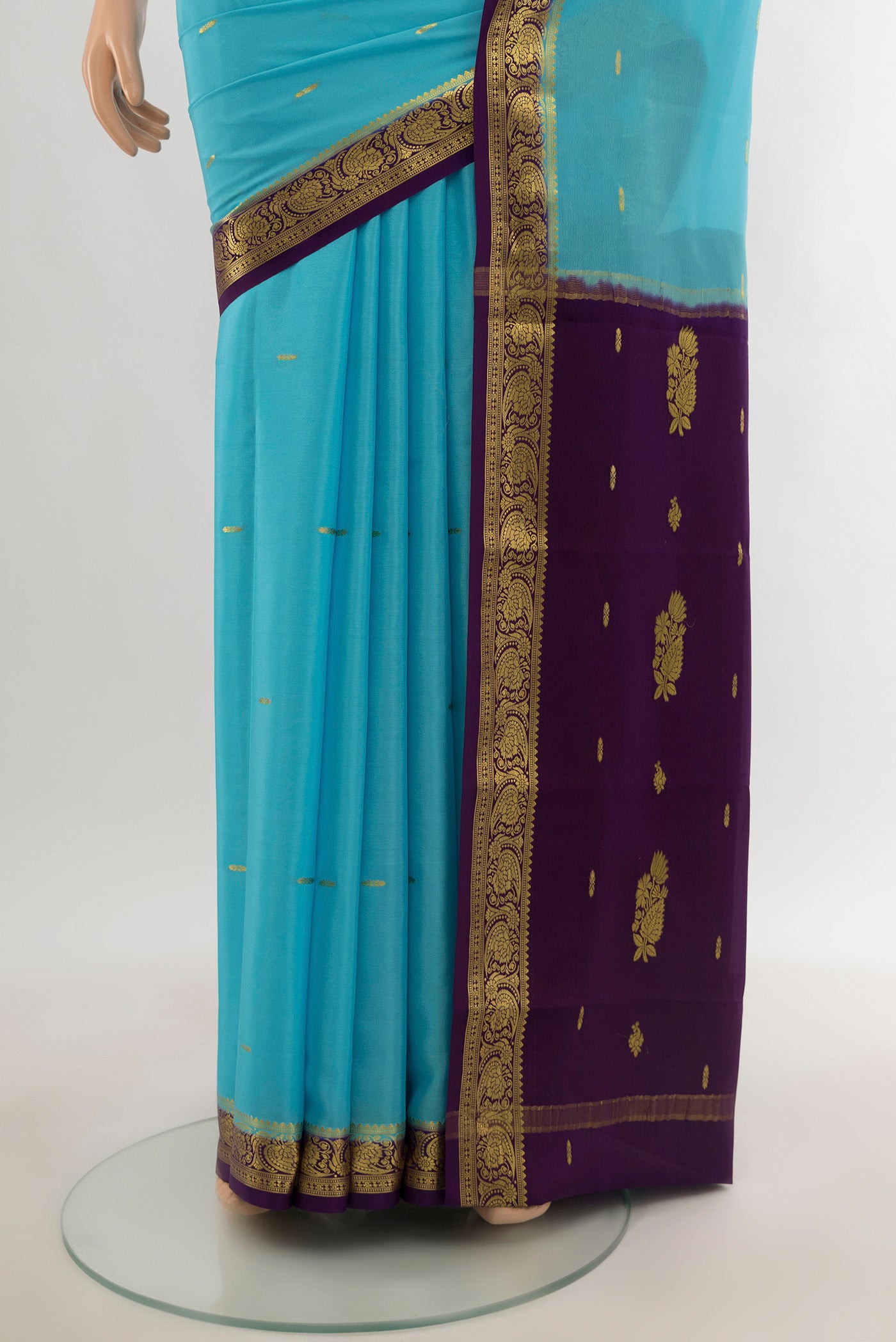 Pleats and pallu of Sky Blue Mysore Crepe Saree with Zari Butta on the body and Silk Border. 
