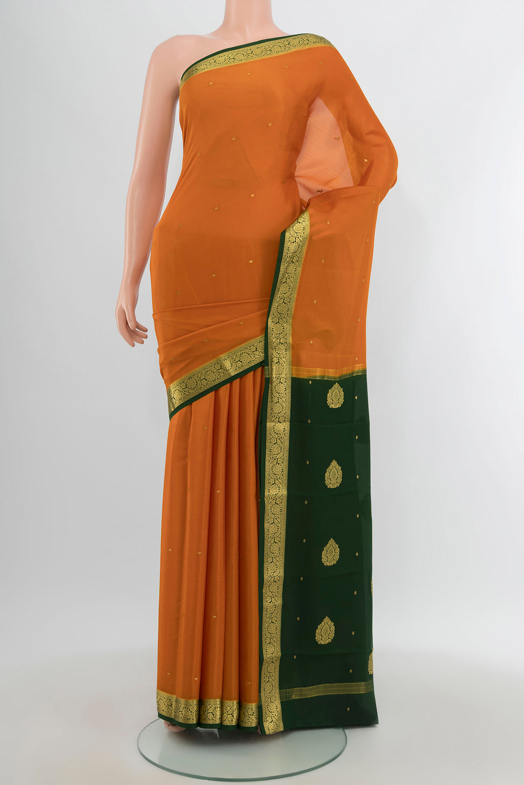 Mustard Mysore Crepe Saree with Zari Butta on the body and Zari Border.  displayed on a mannequin