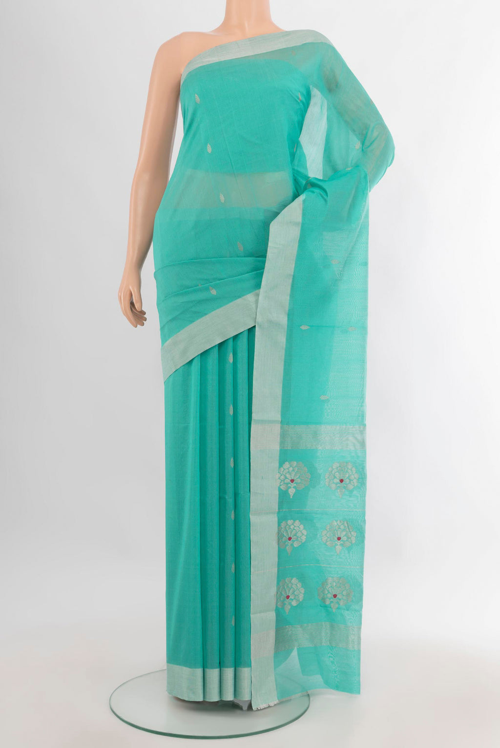 Sea Green Chanderi Cotton Saree with Zari Butta on the body and Zari Border.  displayed on a mannequin
