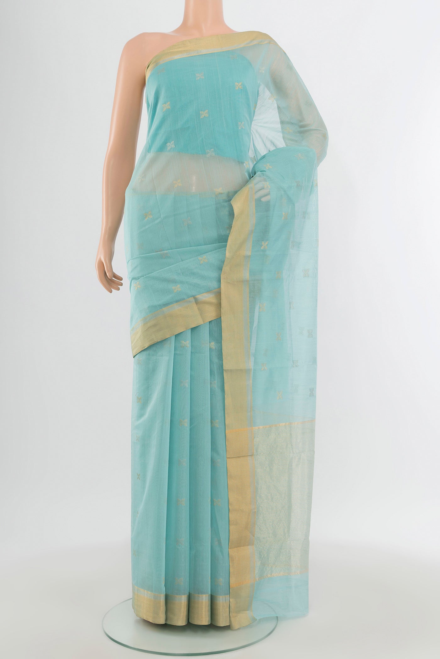 Light Blue Chanderi Silk Cotton Saree with Zari Butta on the body and Zari Border.  displayed on a mannequin