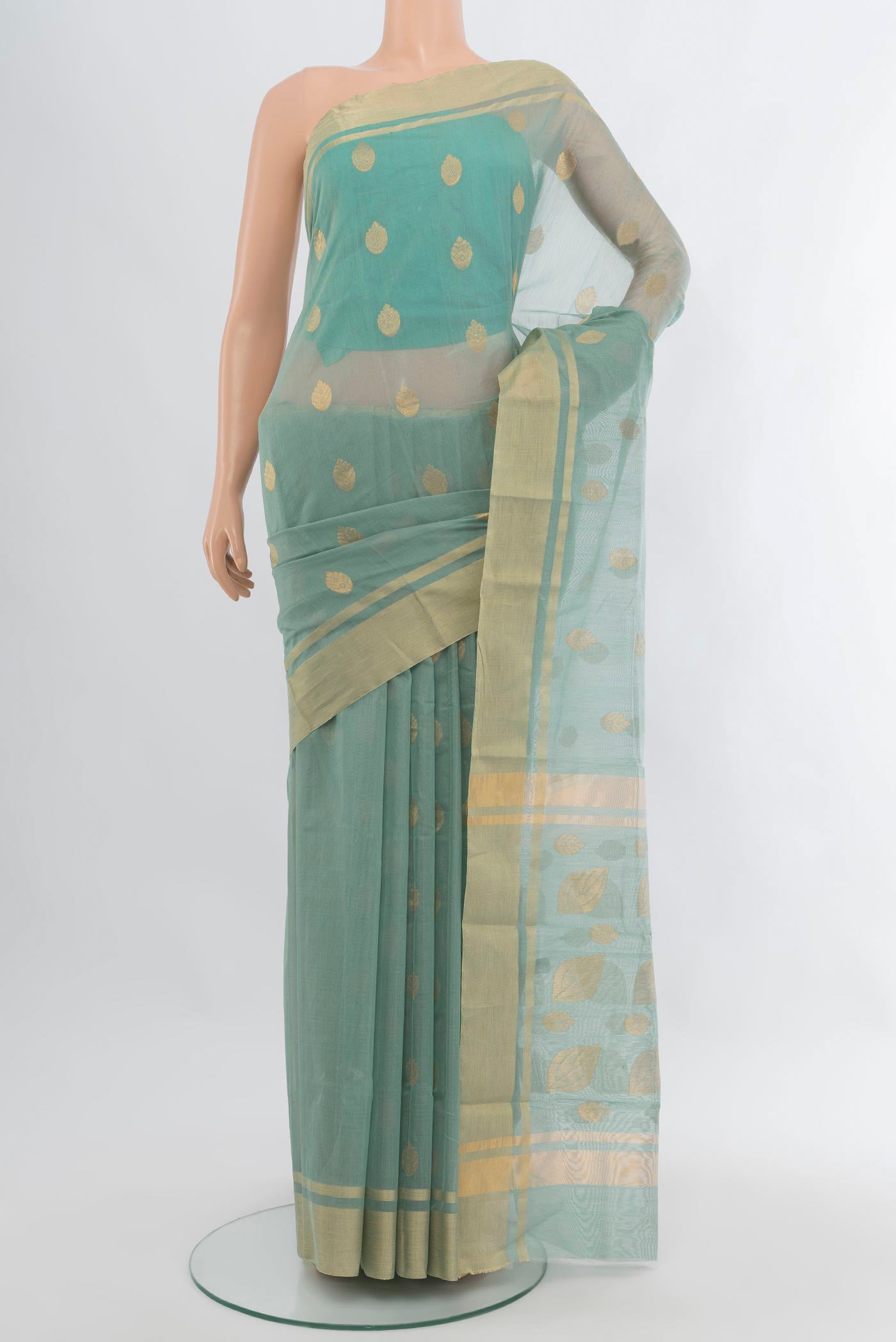 Blue Grey Chanderi Silk Cotton Saree with Zari Butta on the body and Zari Border.  displayed on a mannequin