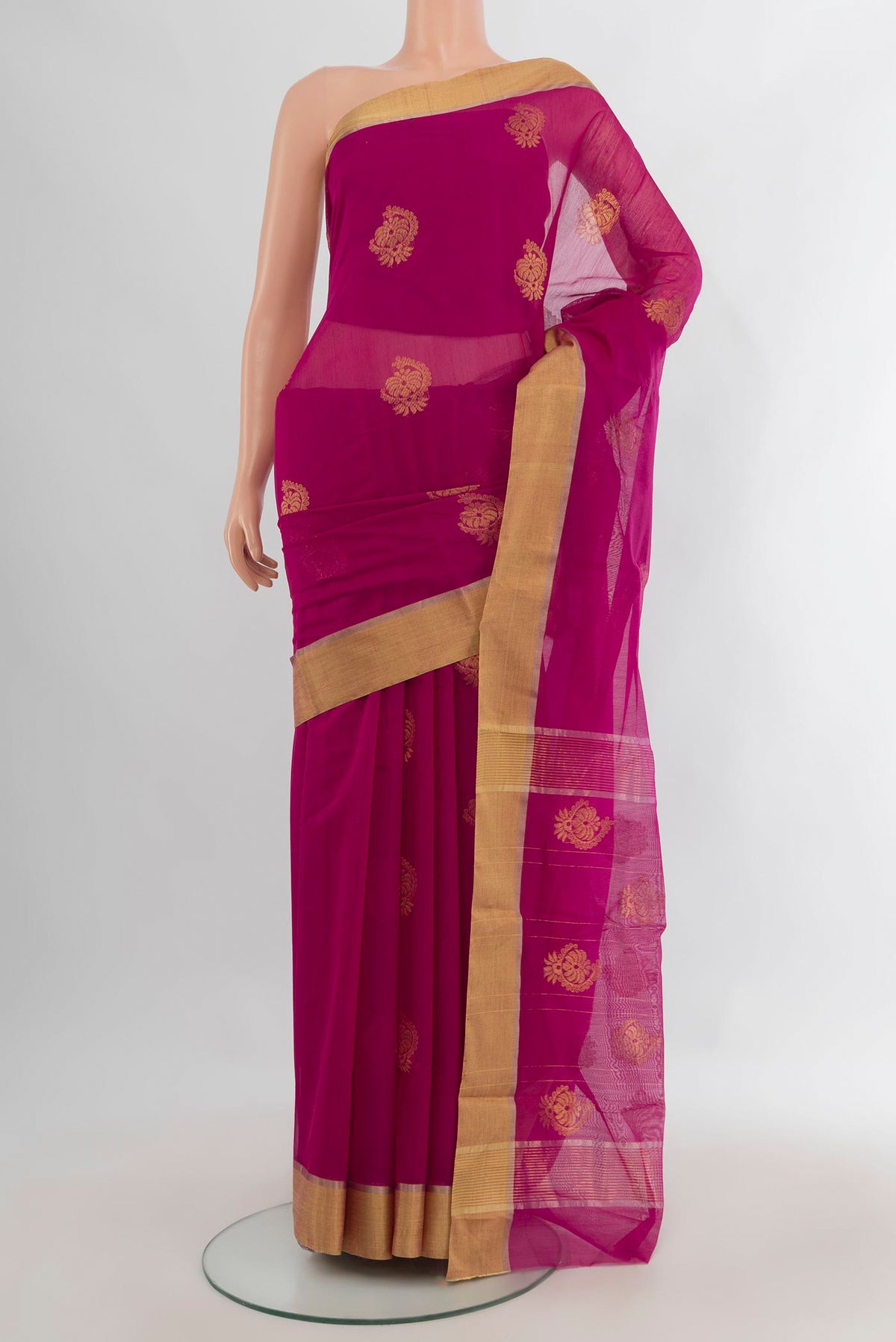 Rani Pink Chanderi Cotton Saree with Zari Butta on the body and Zari Border.  displayed on a mannequin