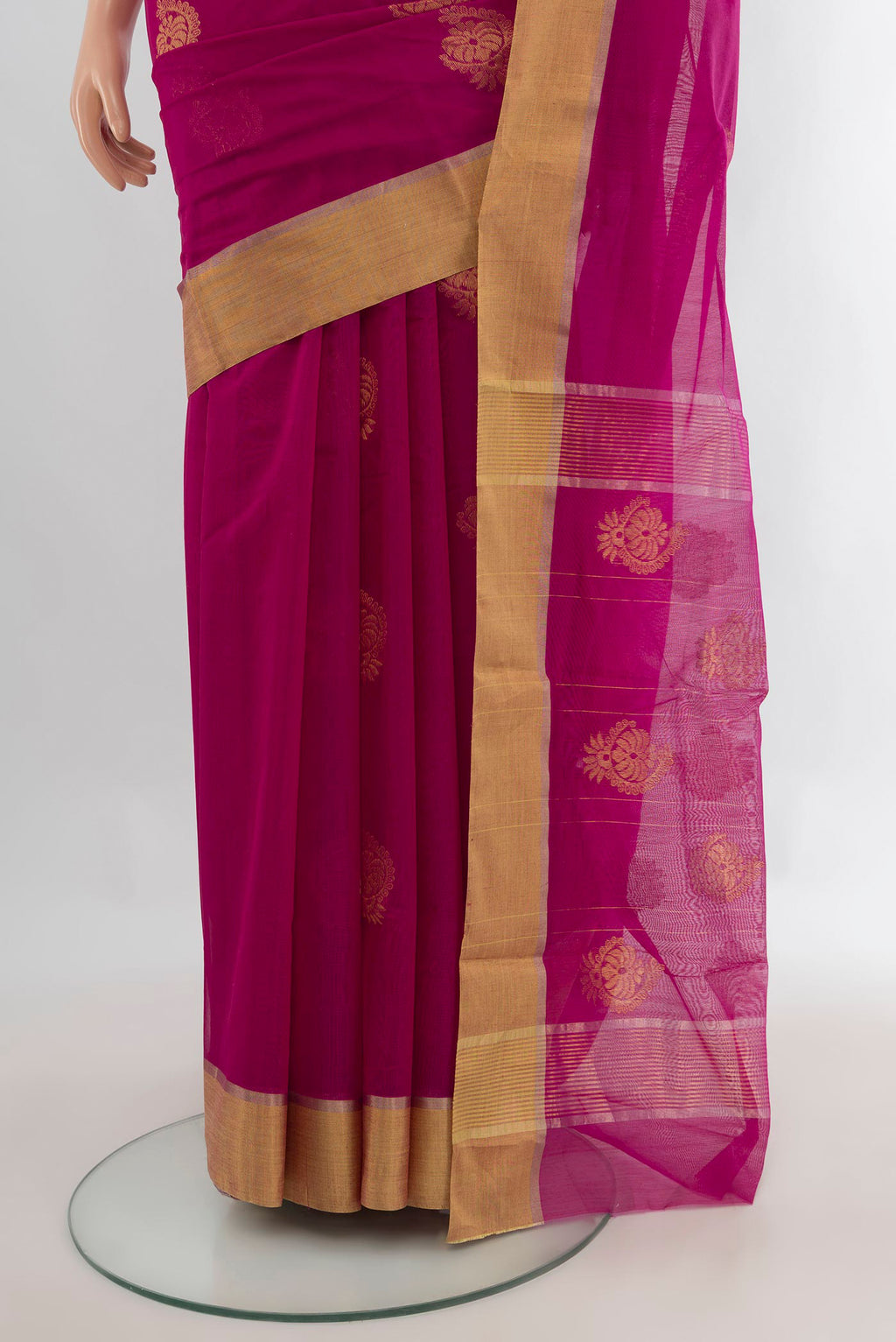 Pleats and pallu of Rani Pink Chanderi Cotton Saree with Zari Butta on the body and Zari Border. 