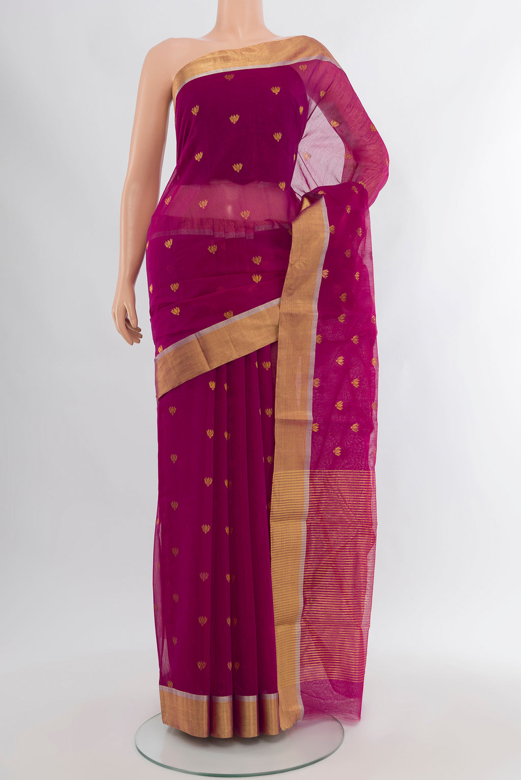 Magenta Chanderi Silk Cotton Saree with Zari Butta on the body and Zari Border.  displayed on a mannequin