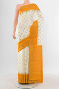 Off White Pochampally Silk Saree with Pure Ikat on the body and Zari Border.  displayed on a mannequin