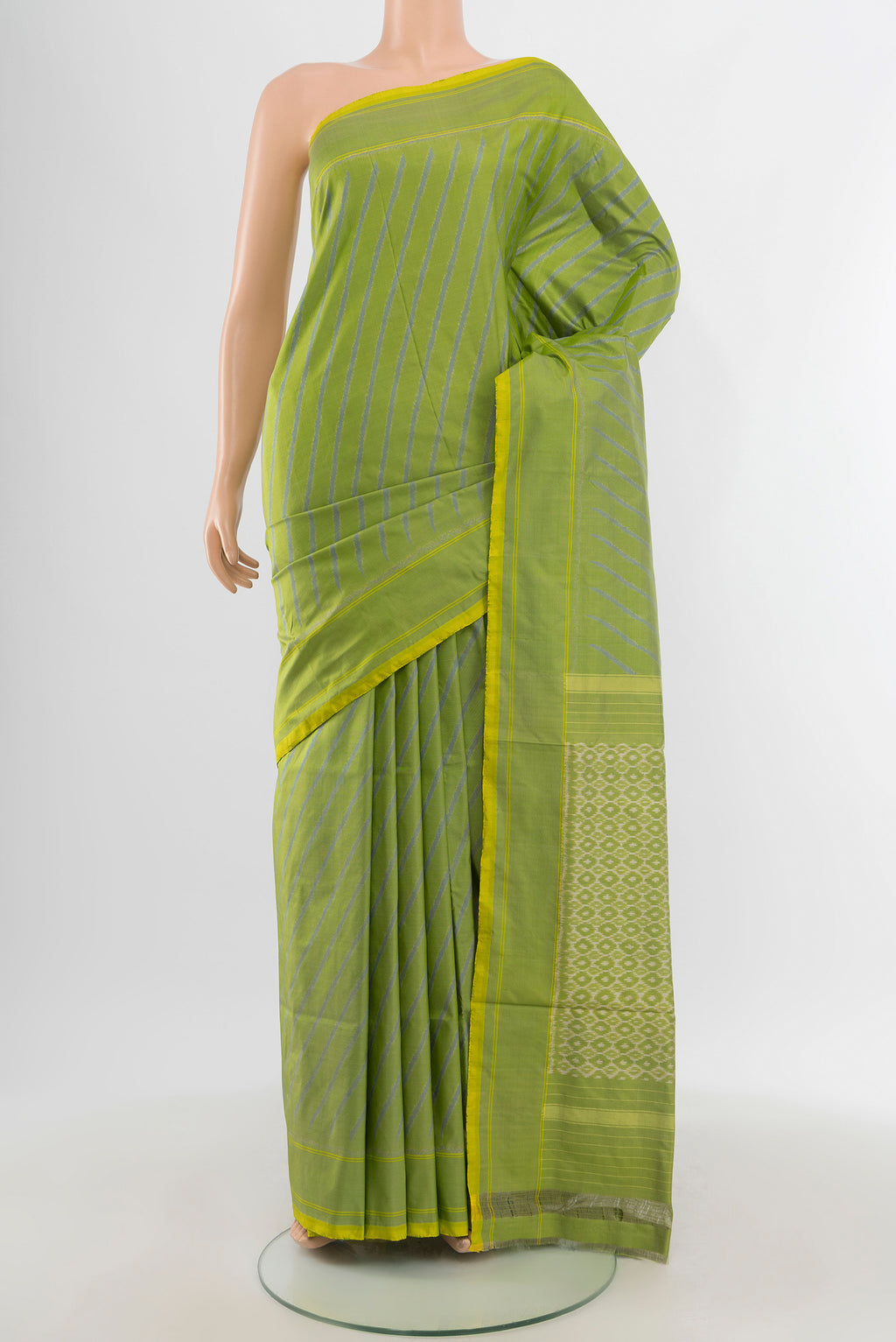 Light Green Pochampally Silk Saree with Ikat design on the body and Plain Border.  displayed on a mannequin