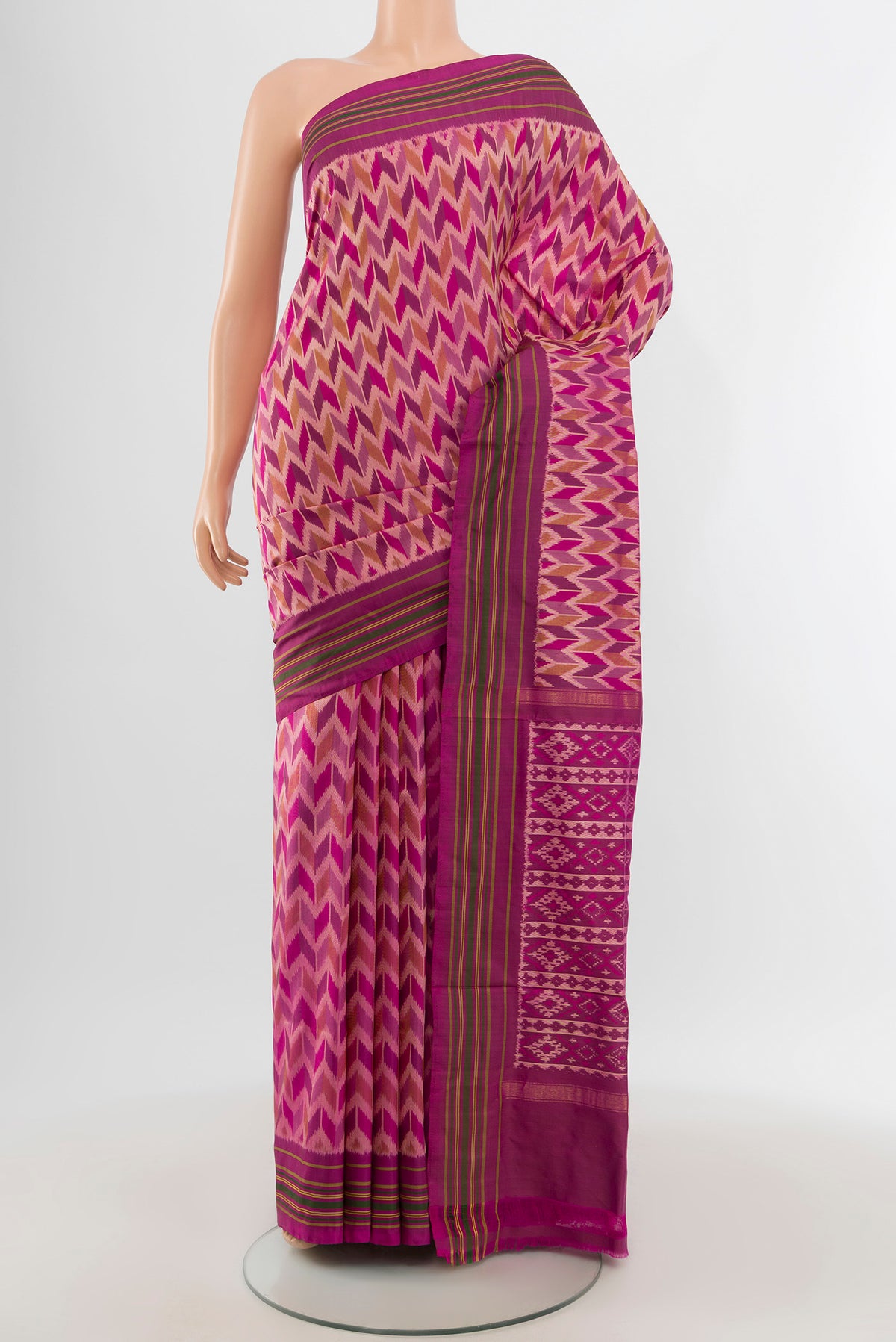 Magenta Pochampally Silk Saree with Ikat design on the body and Plain Border.  displayed on a mannequin