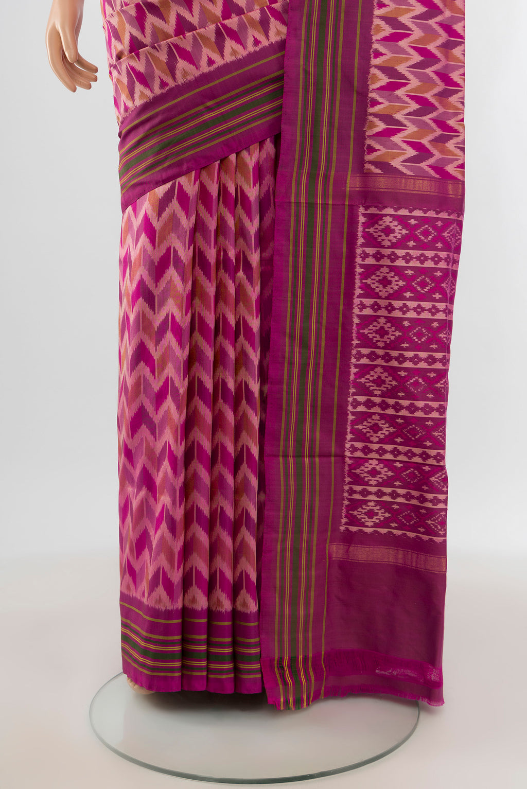 Pleats and pallu of Magenta Pochampally Silk Saree with Ikat design on the body and Plain Border. 