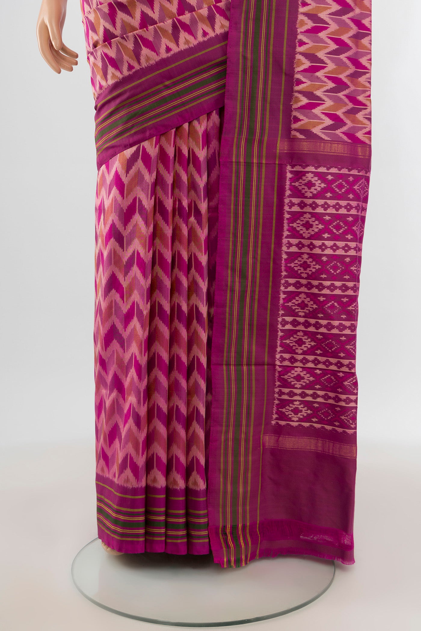 Pleats and pallu of Magenta Pochampally Silk Saree with Ikat design on the body and Plain Border. 