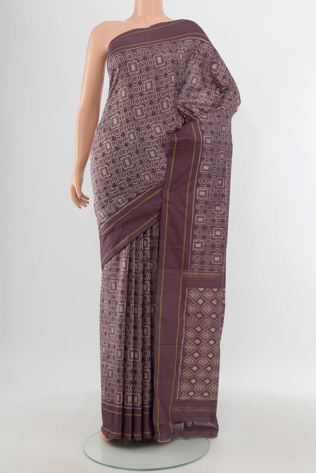 Burgundy Pochampally Silk Saree with Ikat design on the body and Plain Border.  displayed on a mannequin