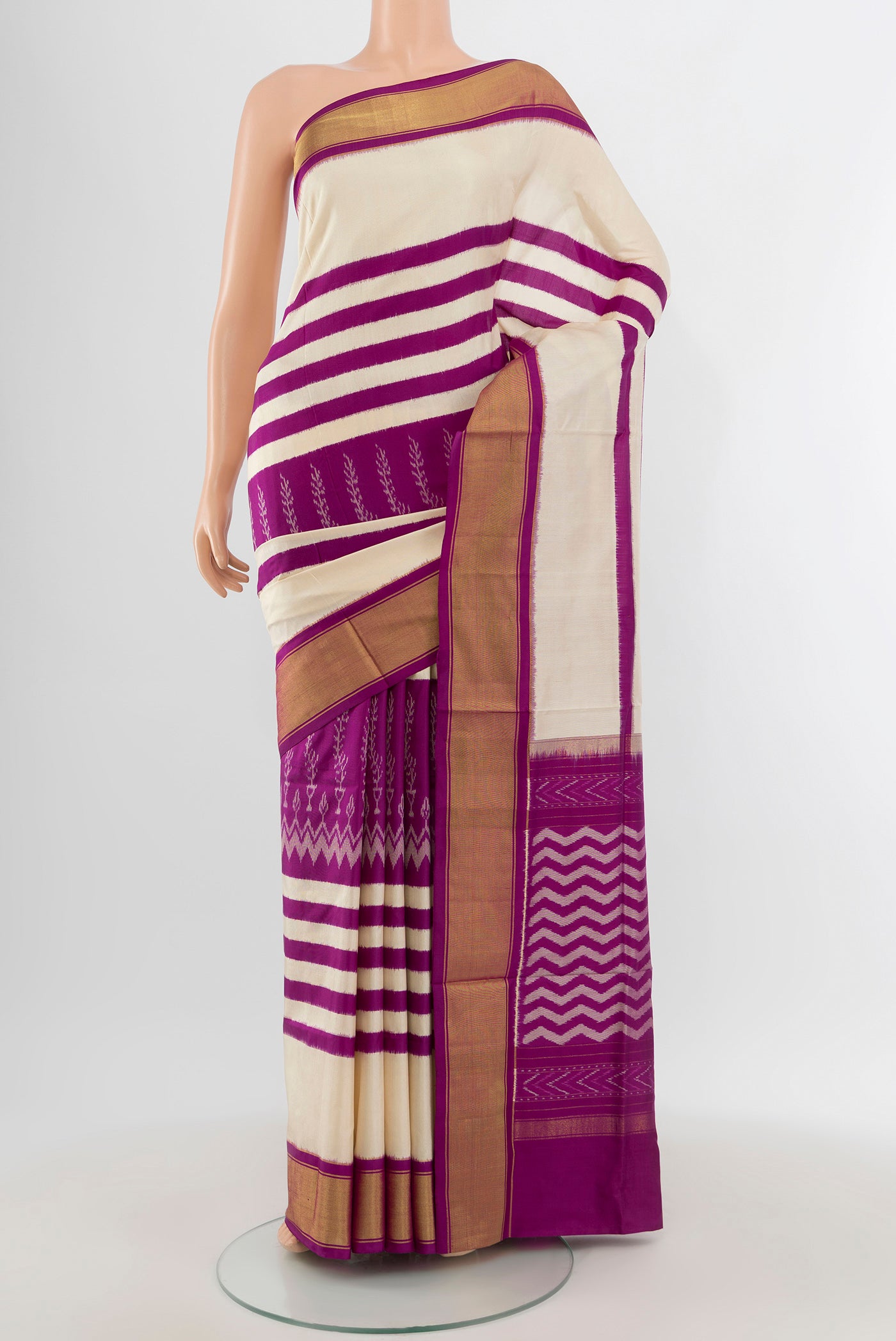 White Pochampally Silk Saree with Ikat design on the body and Zari Border.  displayed on a mannequin