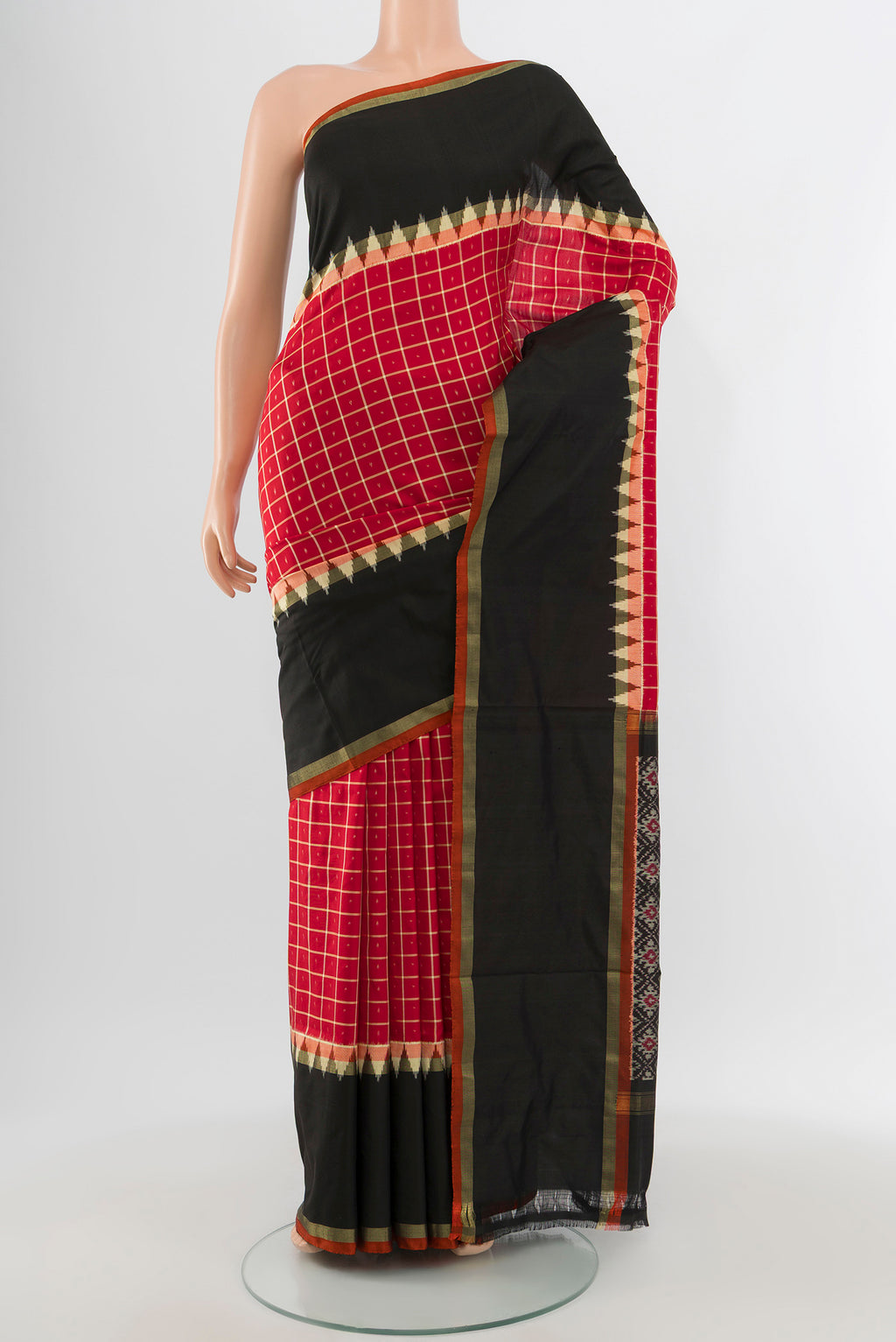 Red Pochampally Silk Saree with Ikat design on the body and Ikat Border.  displayed on a mannequin