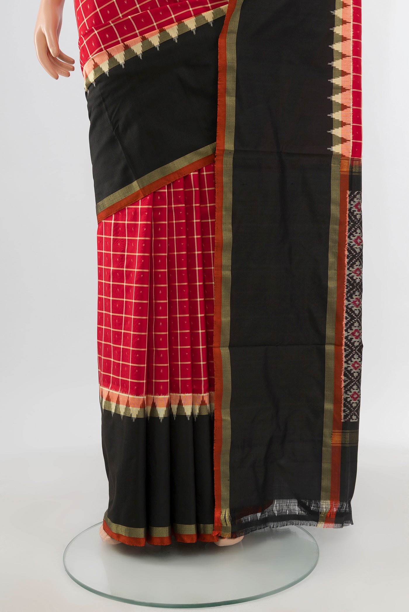 Pleats and pallu of Red Pochampally Silk Saree with Ikat design on the body and Ikat Border. 