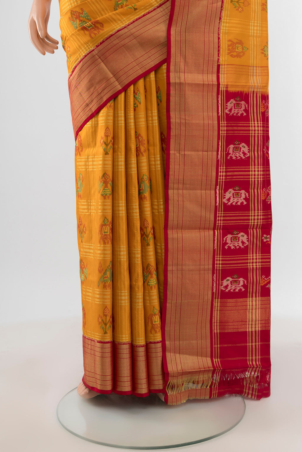 Pleats and pallu of Mustard Pochampally Silk Saree with Ikat design on the body and Zari Border. 