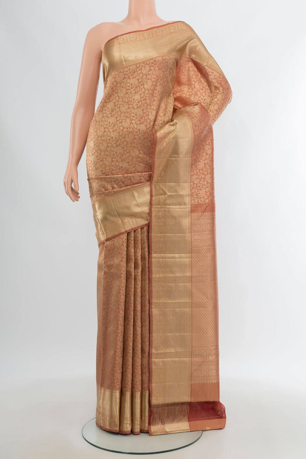 Bronze Kanchipuram Silk Saree with Zari Brocade on the body and Zari Border.  displayed on a mannequin