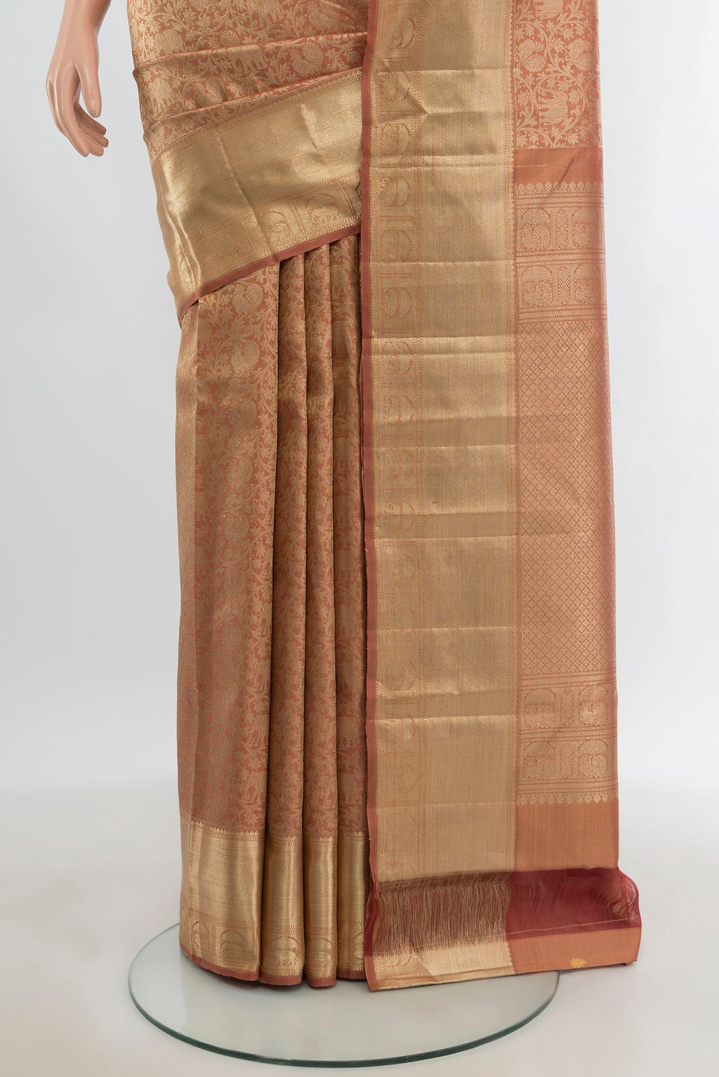 Pleats and pallu of Bronze Kanchipuram Silk Saree with Zari Brocade on the body and Zari Border. 