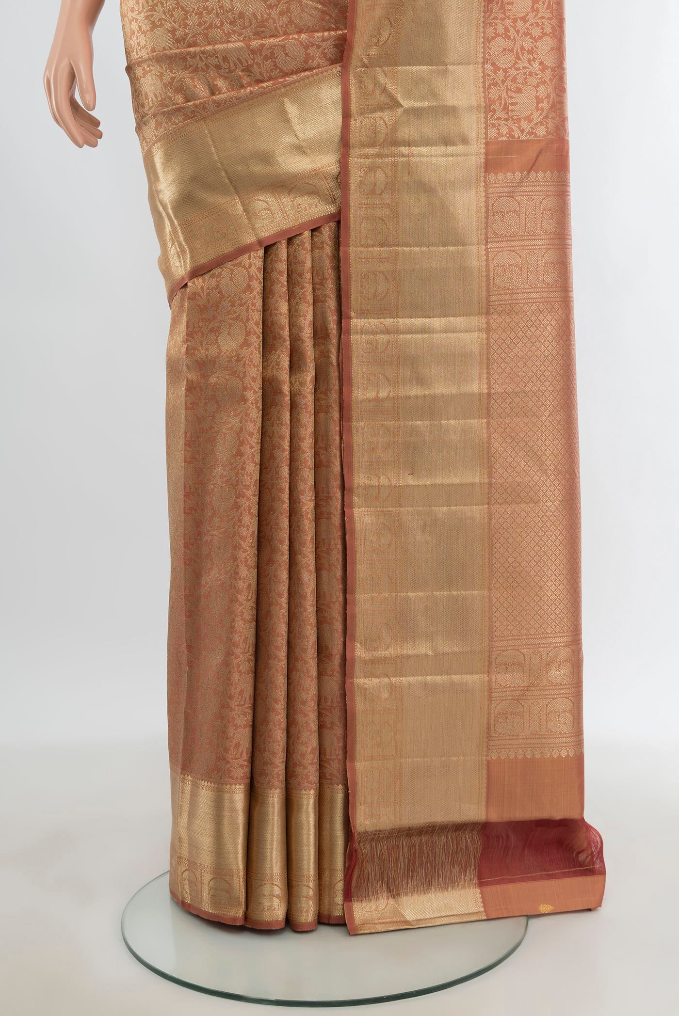 Pleats and pallu of Bronze Kanchipuram Silk Saree with Zari Brocade on the body and Zari Border. 