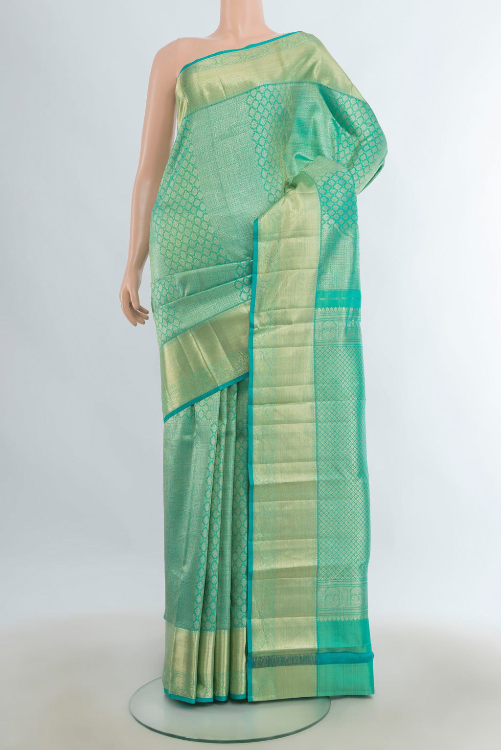 Pure Silk Sea Green Kanchipuram Saree with Zari Brocade on the body and Zari Border.  displayed on a mannequin