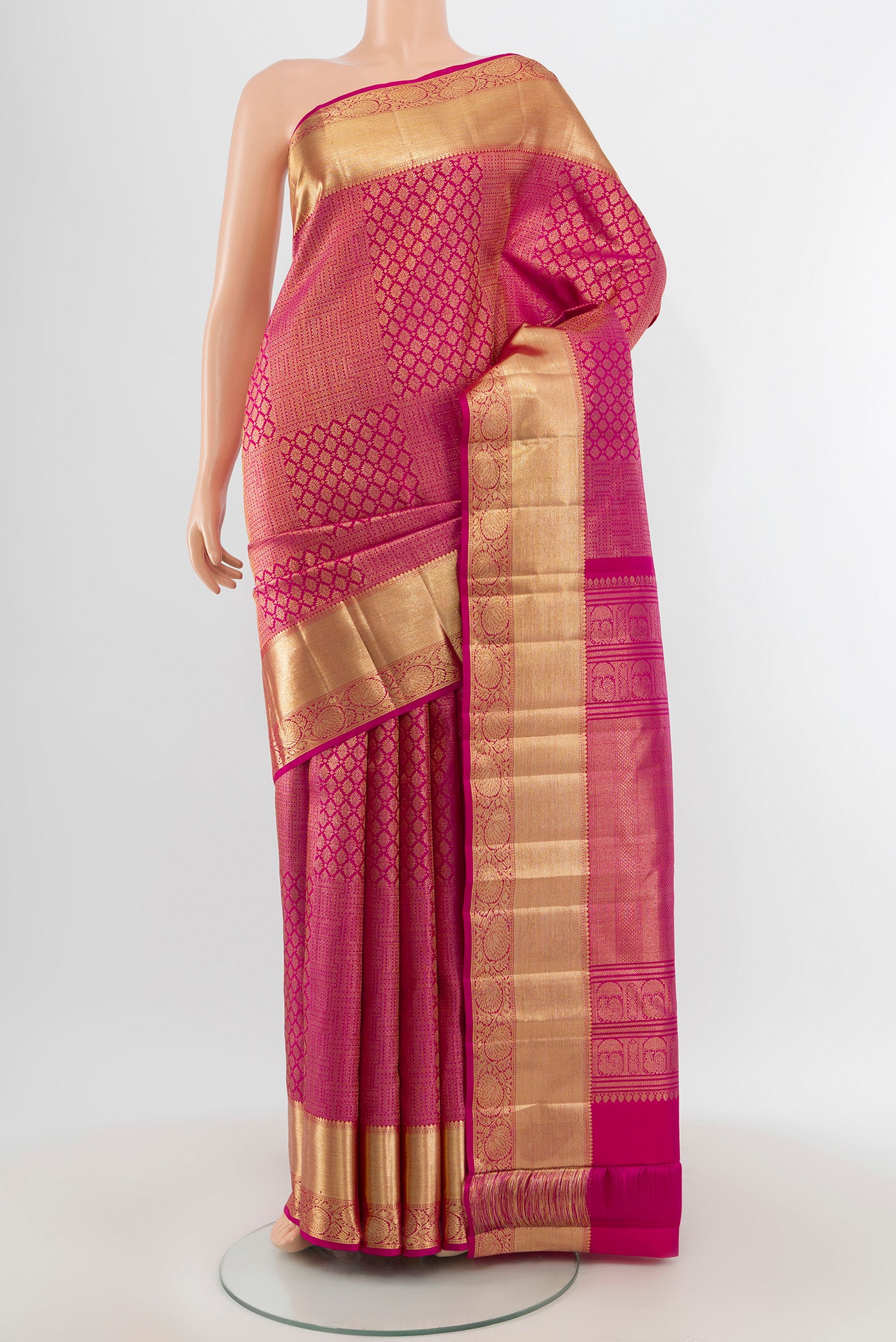 Pink Kanchipuram Silk Saree with Zari Brocade on the body and Zari Border.  displayed on a mannequin