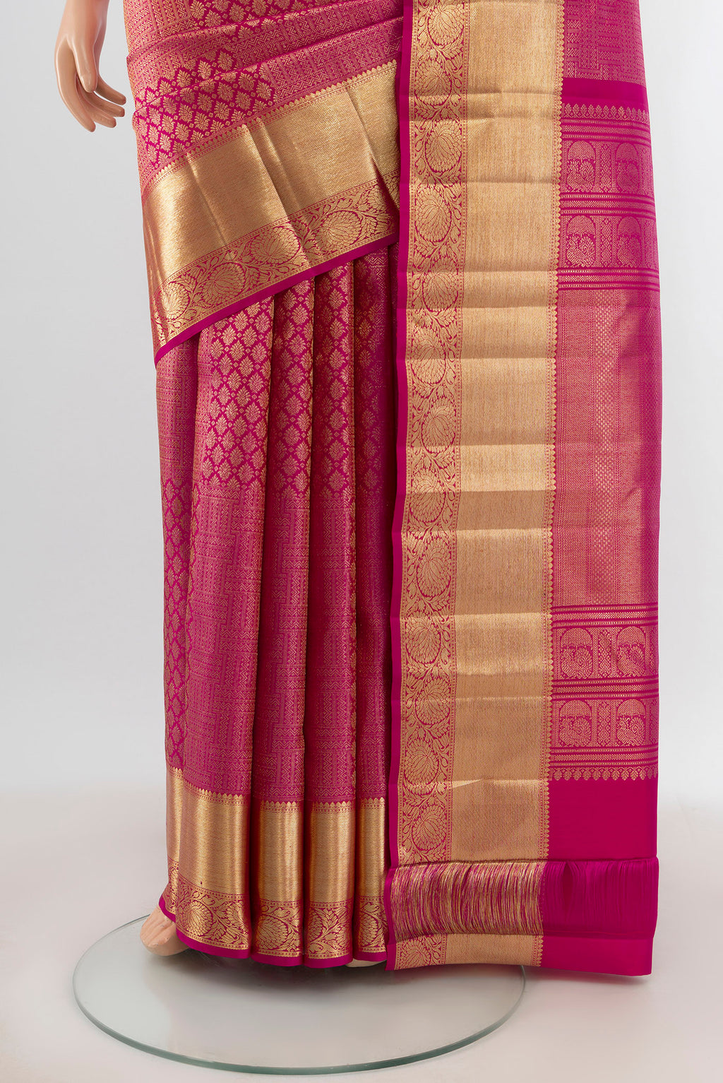 Pleats and pallu of Pink Kanchipuram Silk Saree with Zari Brocade on the body and Zari Border. 