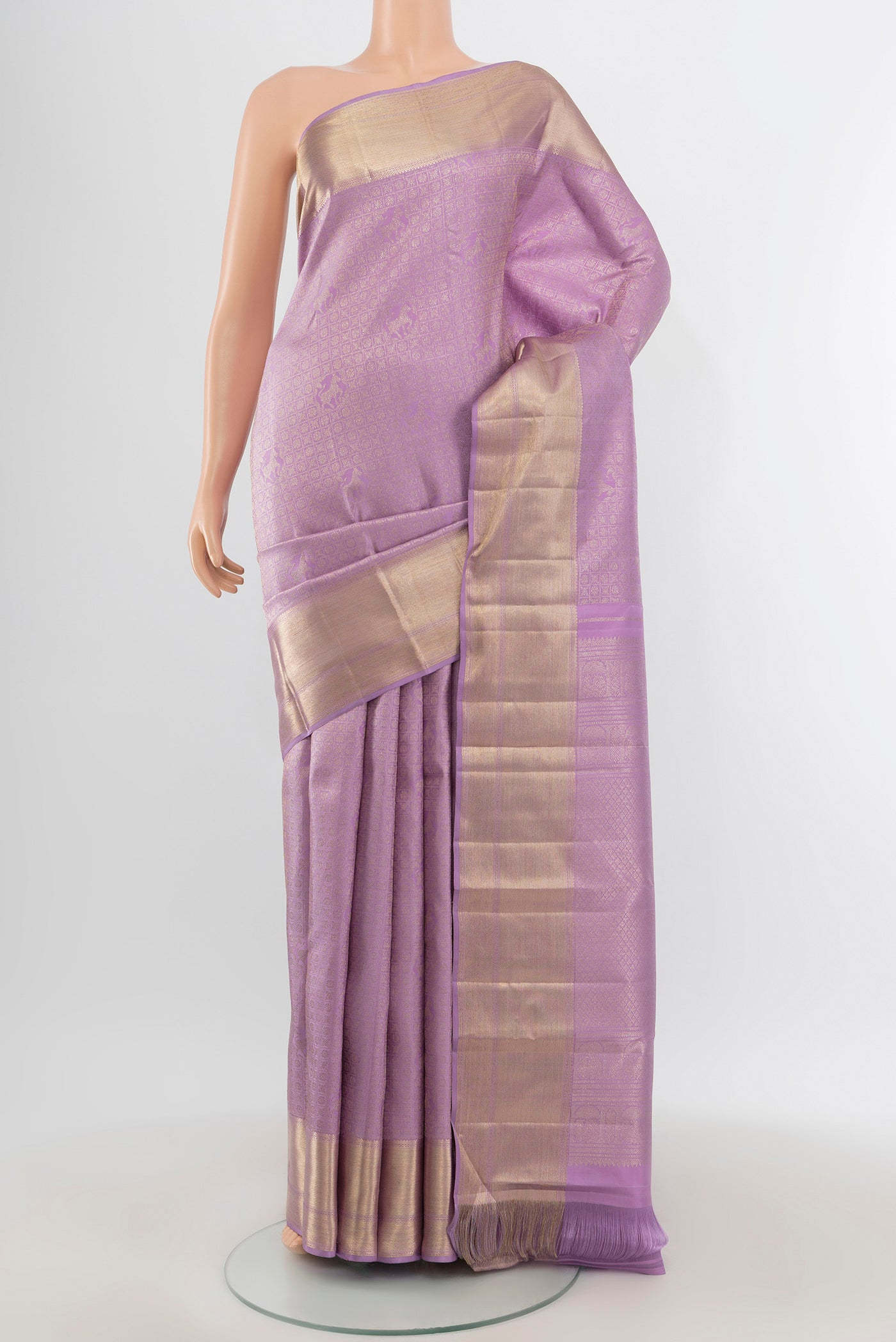 Lavender Kanchipuram Silk Saree with Zari Brocade on the body and Zari Border.  displayed on a mannequin