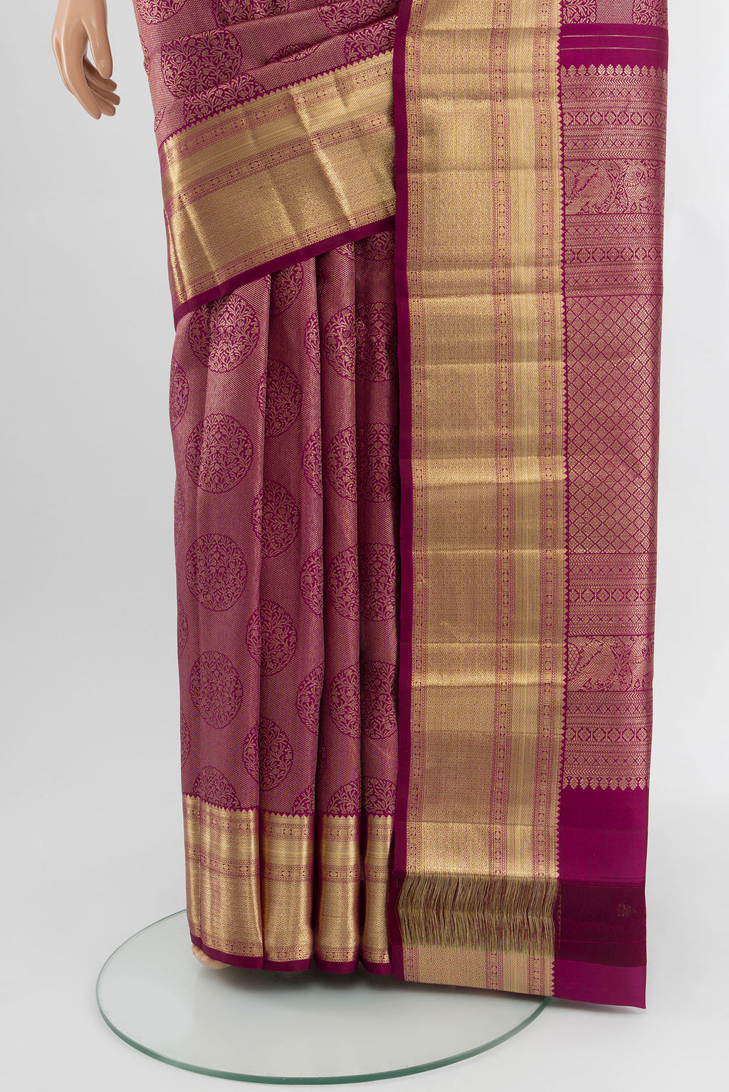 Pleats and pallu of Magenta Kanchipuram Silk Saree with Zari Brocade on the body and Zari Border. 