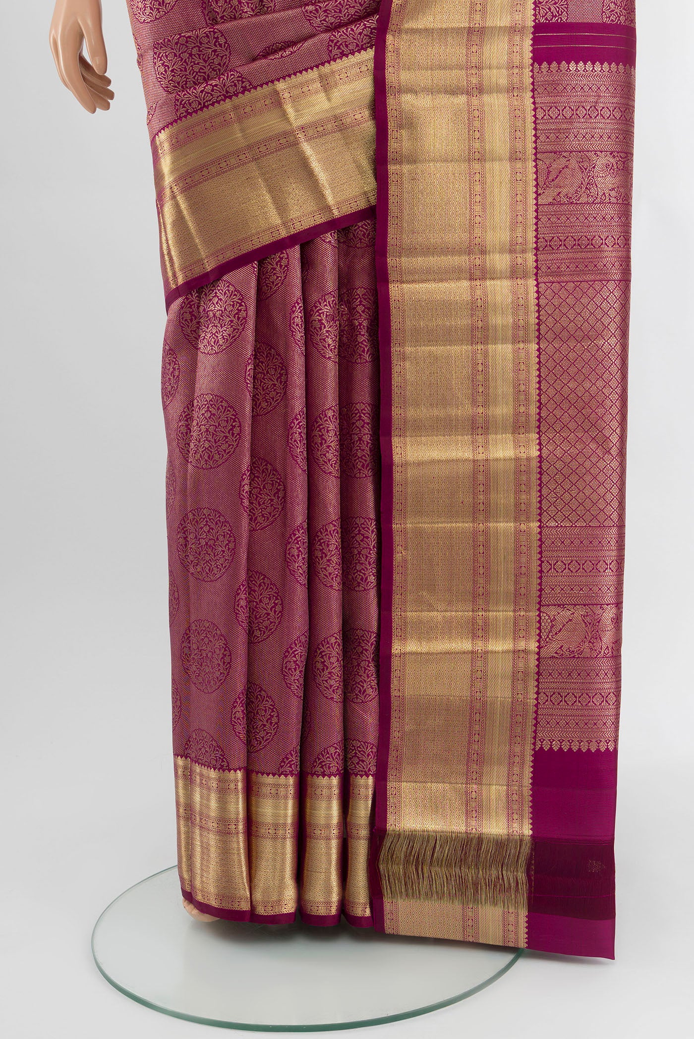 Pleats and pallu of Magenta Kanchipuram Silk Saree with Zari Brocade on the body and Zari Border. 
