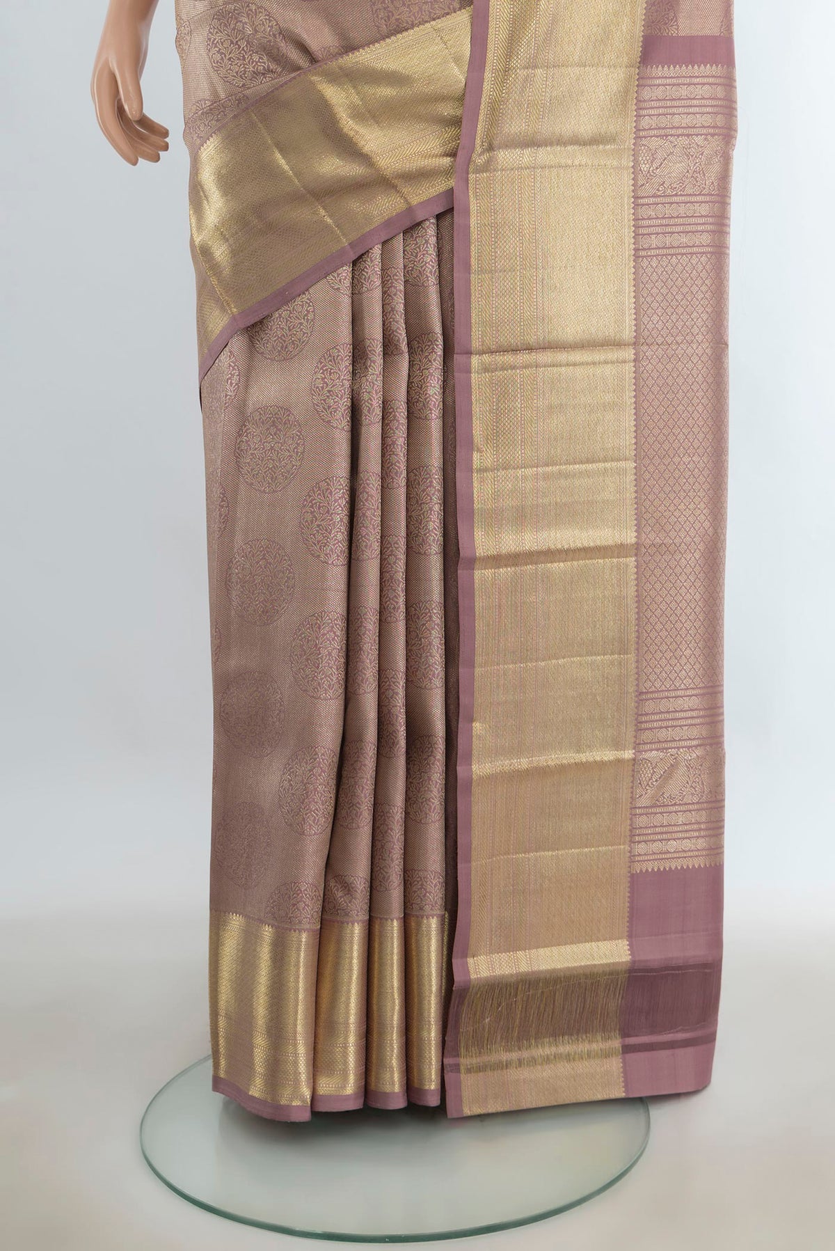 Pleats and pallu of Pure Silk Bronze Kanchipuram Saree with Zari Butta on the body and Silk Border. 