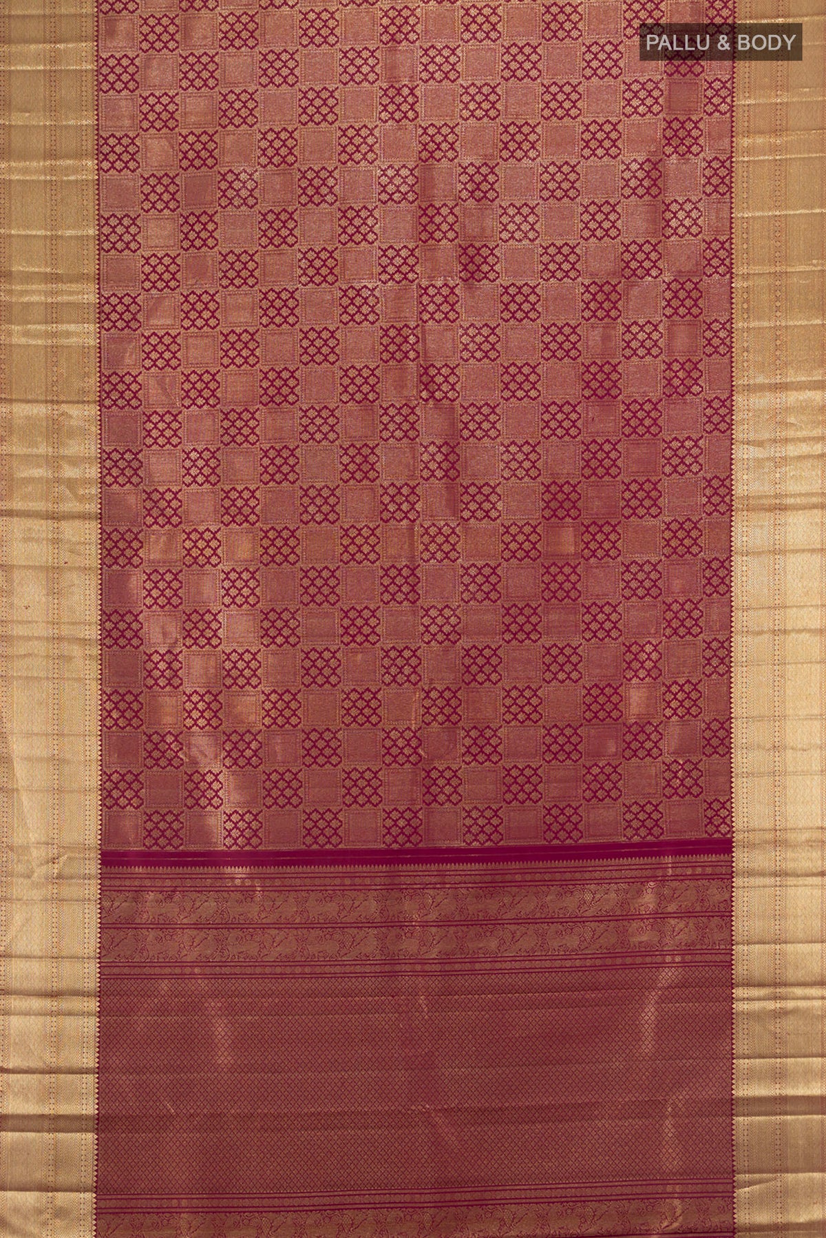 Flat view of Maroon Kanchipuram Silk Saree with Zari Brocade on the body and Zari Border. 