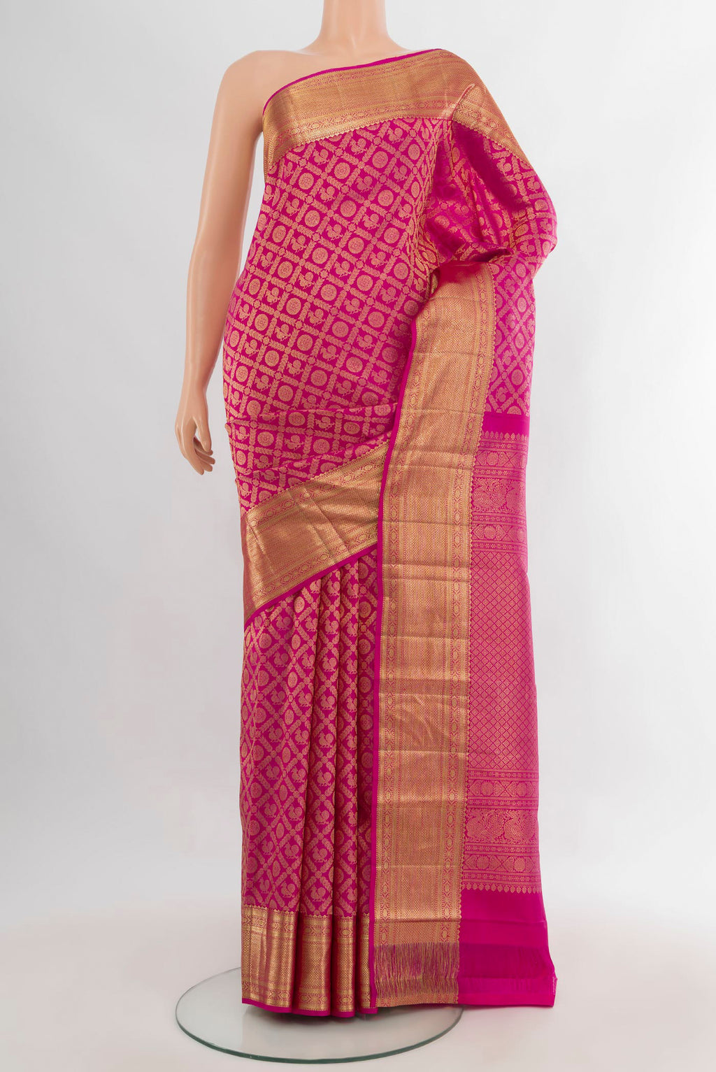 Pure Silk Magenta Kanchipuram Saree with Zari Brocade on the body and Zari Border.  displayed on a mannequin