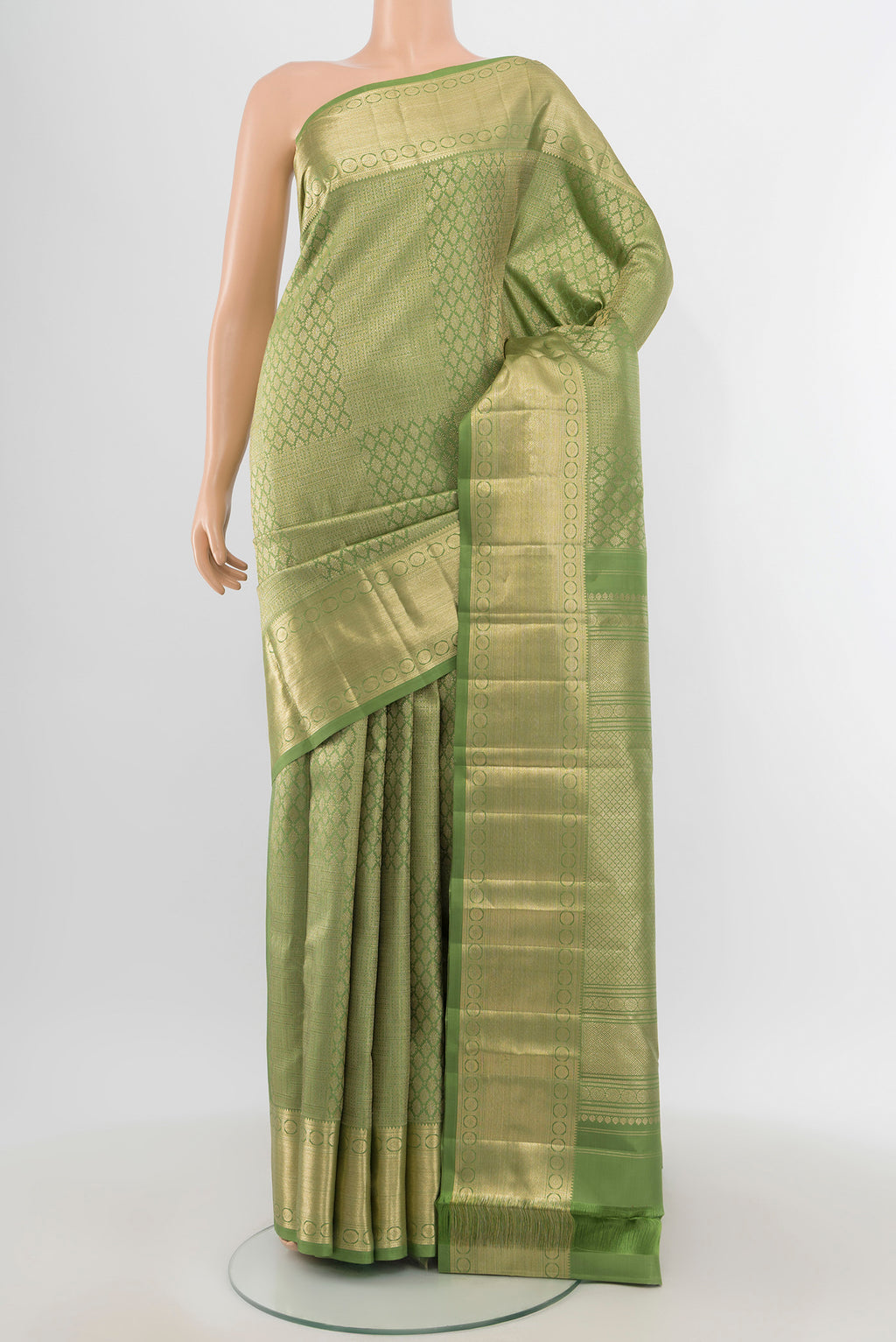 Sage Green Kanchipuram Silk Saree with Zari Brocade on the body and Zari Border.  displayed on a mannequin