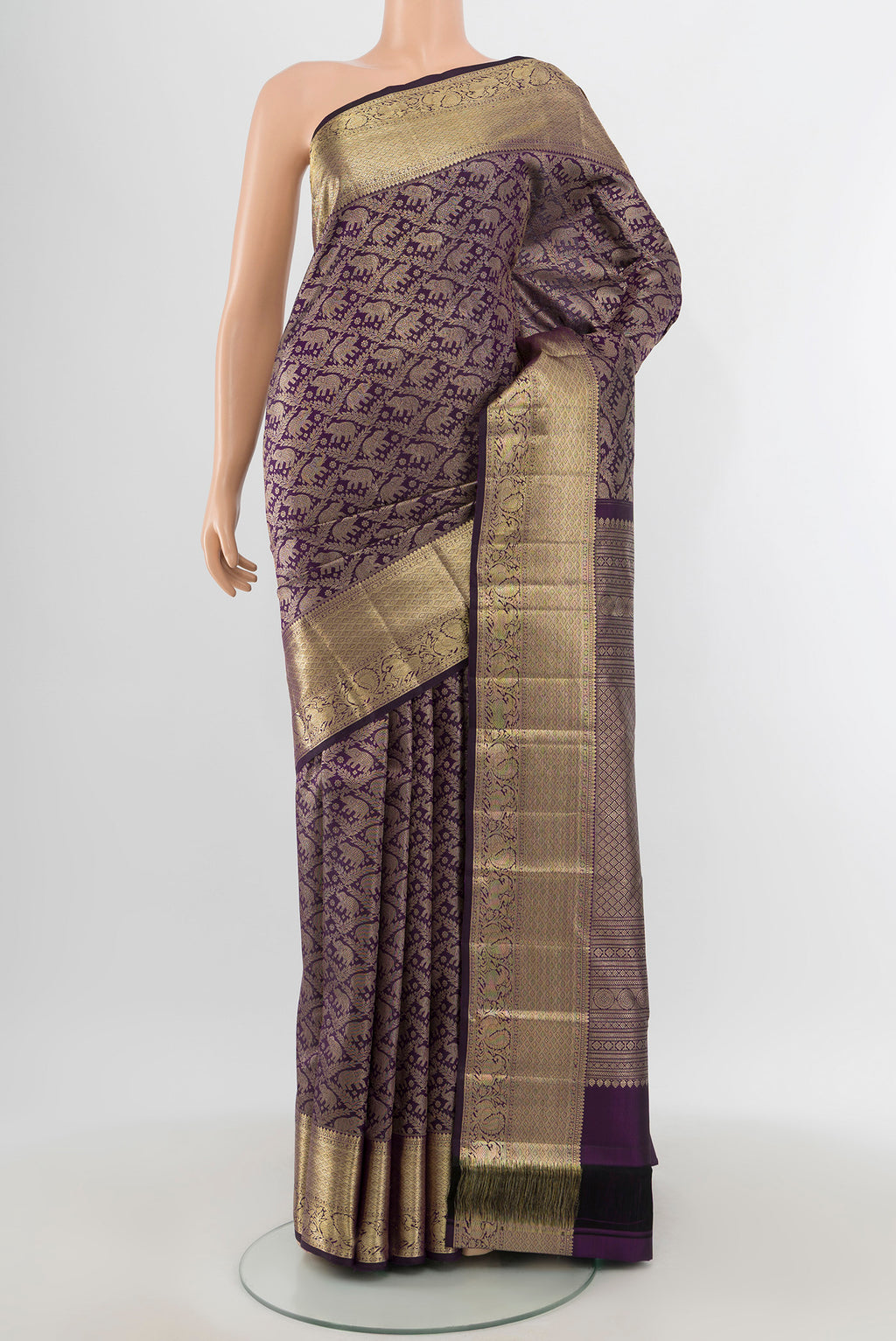 Violet Kanchipuram Silk Saree with Zari Brocade on the body and Zari Border.  displayed on a mannequin
