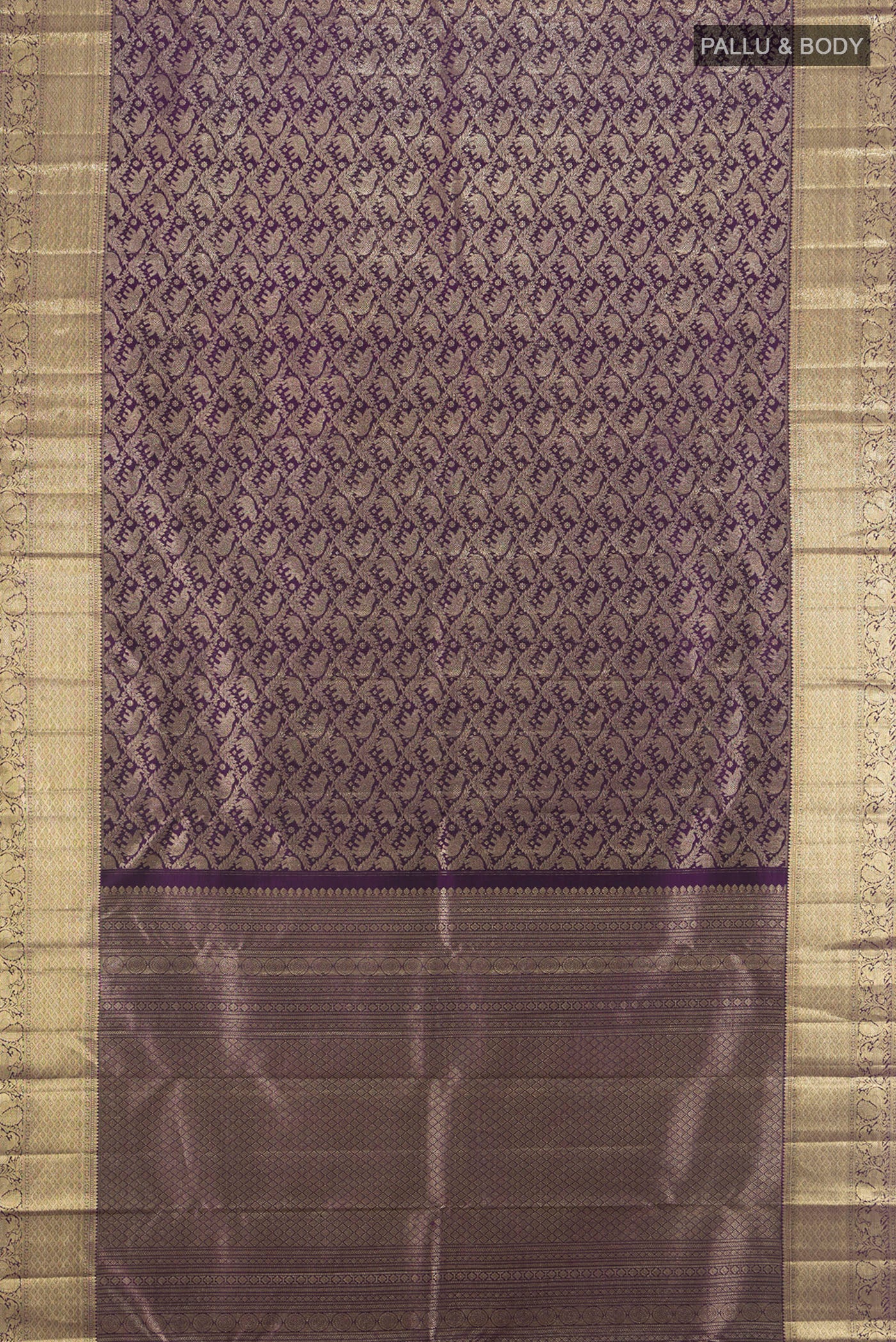 Flat view of Violet Kanchipuram Silk Saree with Zari Brocade on the body and Zari Border. 