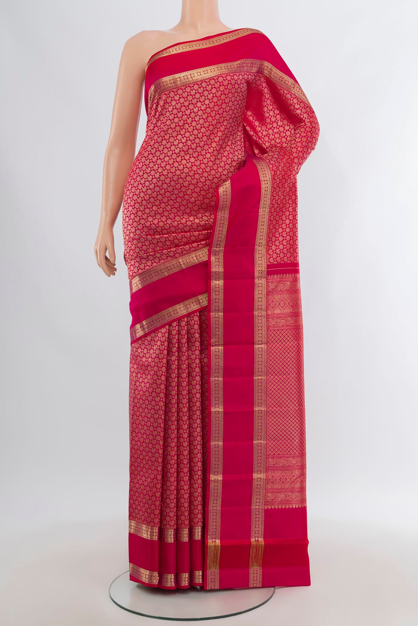 Dark Pink Kanchipuram Silk Saree with Zari Brocade on the body and Zari Border.  displayed on a mannequin