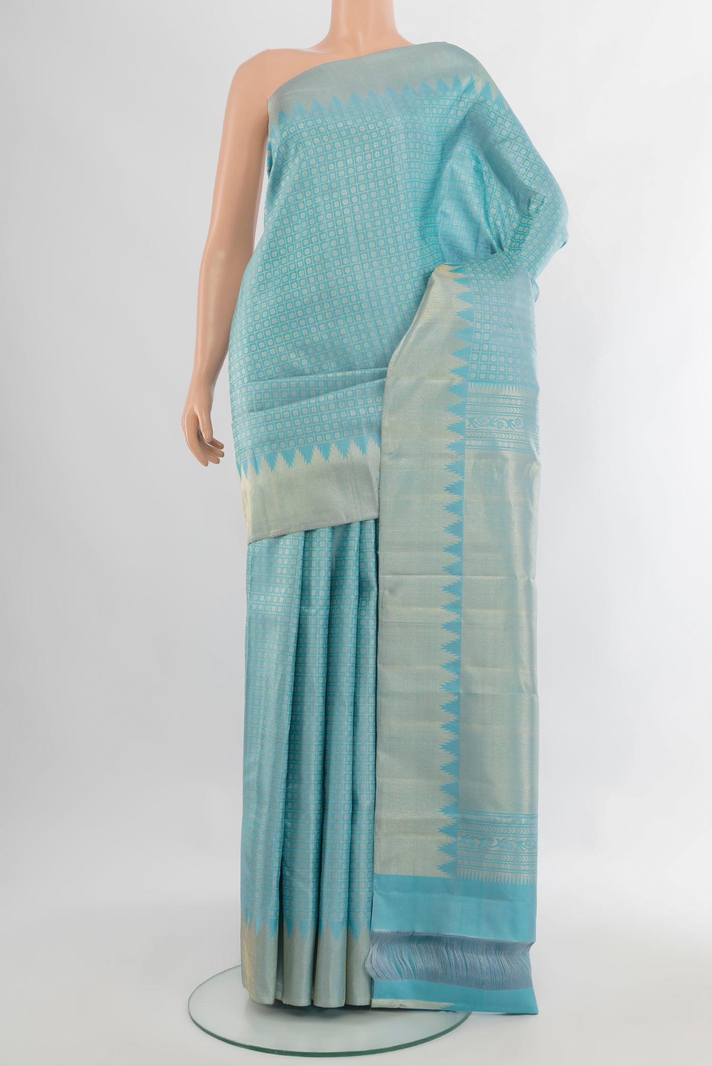 Pure Silk Sky Blue Kanchipuram Saree with Zari Butta on the body and Zari Border.  displayed on a mannequin