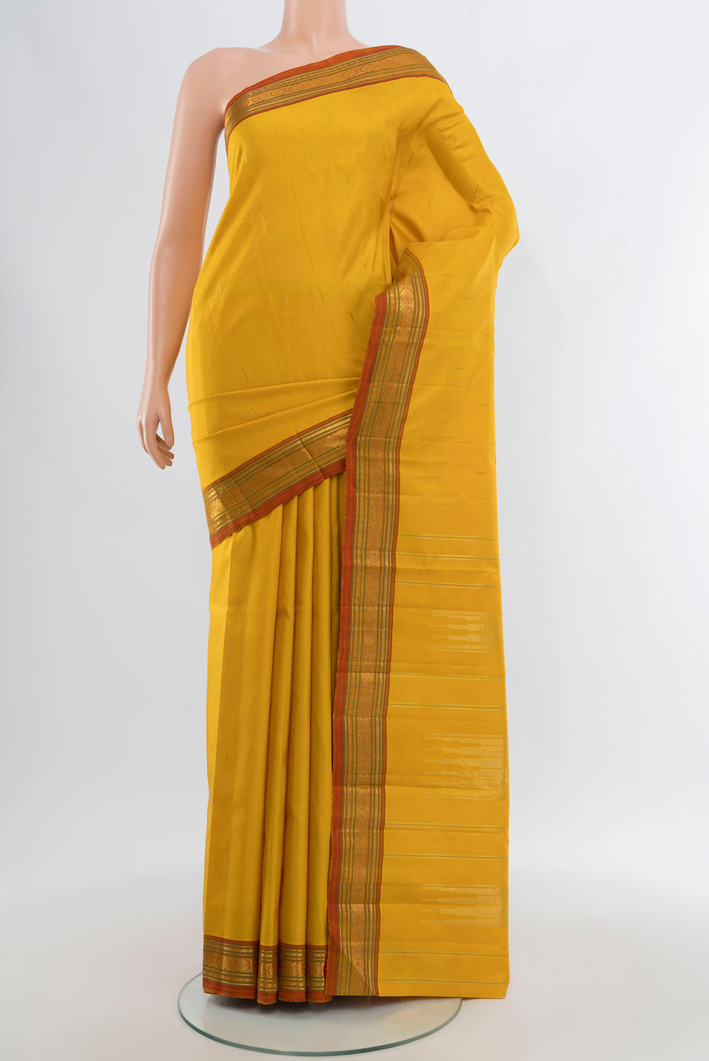 Yellow Kanjivaram Silk Saree with Plain Body and Zari Border.  displayed on a mannequin