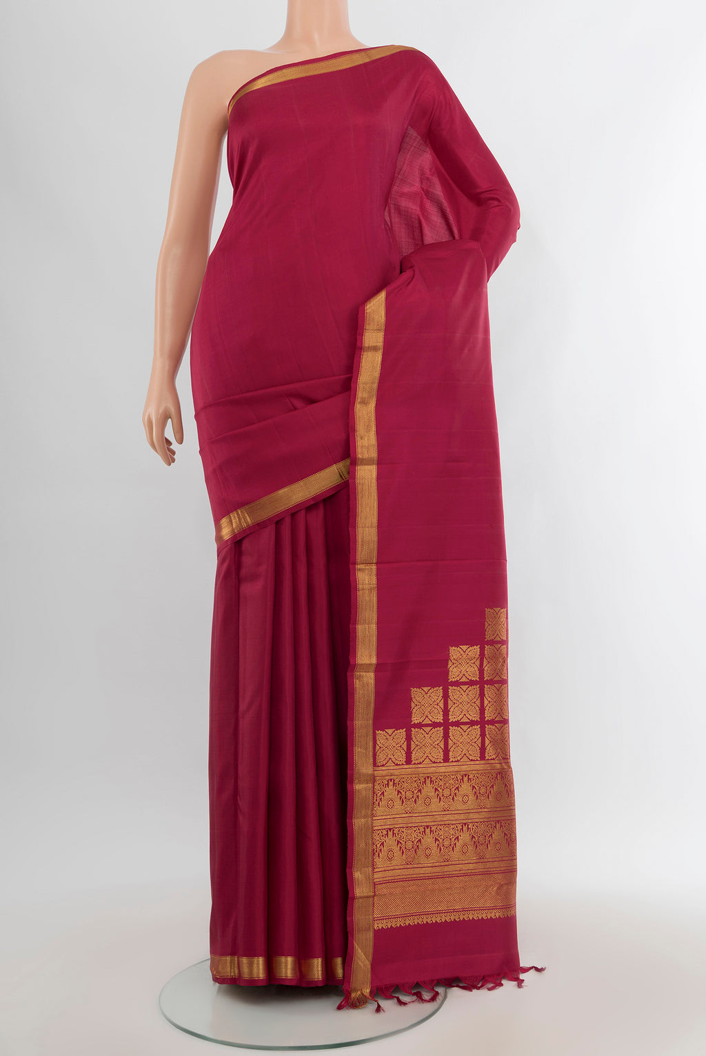 Pure Silk Pure Zari Maroon Kanjivaram Saree with Plain Body and Zari Border.  displayed on a mannequin